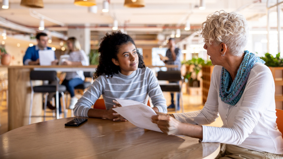 Two women chatting at a job interview
