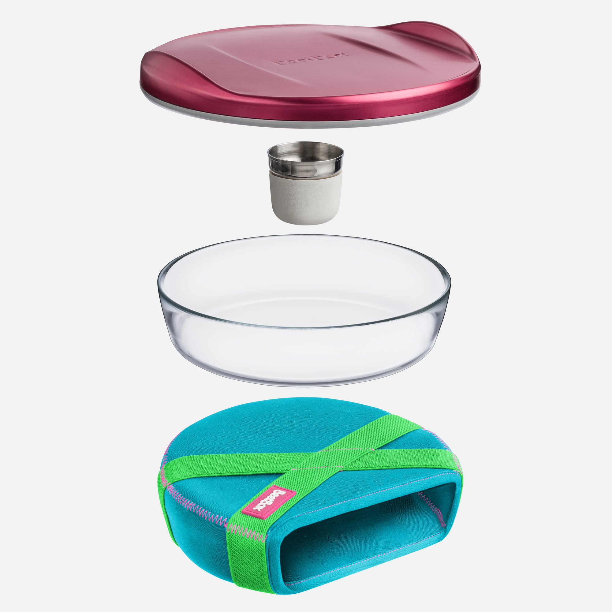 The BeetBox lunch bowl. A glass bowl with a lid, sauce container and sleeve for travel. 