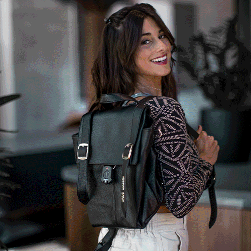 A Gif of brand Airbolt featuring the smart travel lock on handbags, suitcases and hands