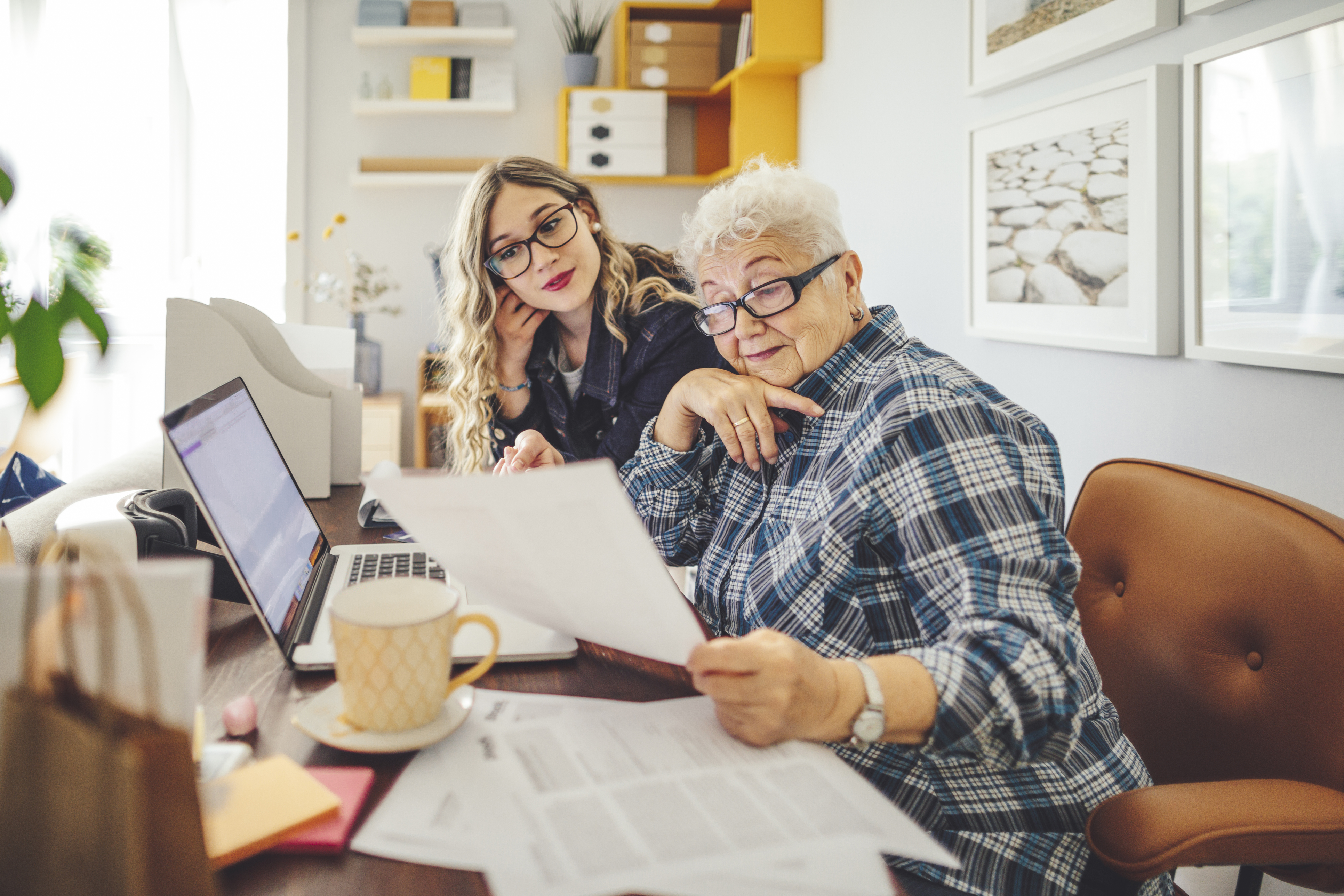 two female business owners looking at the financial papers 