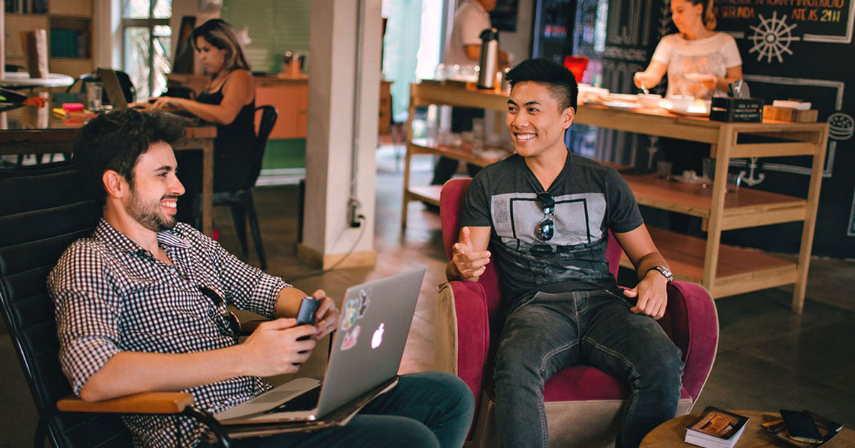 Two young men sitting in a café.