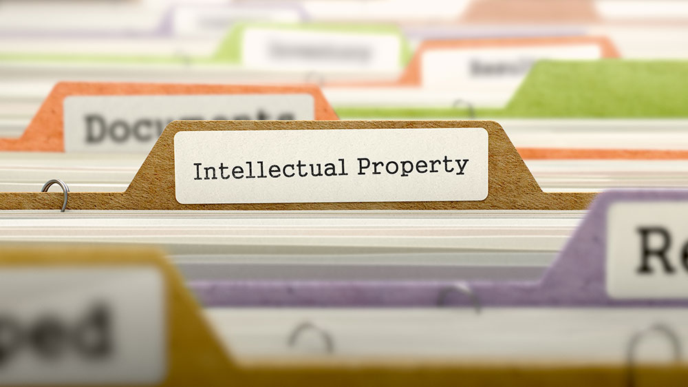 Image of file folders, one of which is labelled “Intellectual Property”.