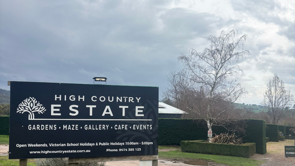 The front signage of High Country Estate.